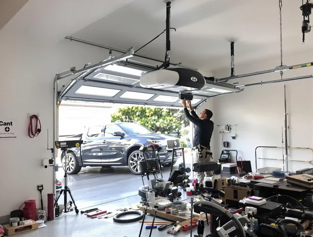 Bay Village Garage Door Repair specialist installing smart garage door opener system in Bay Village home