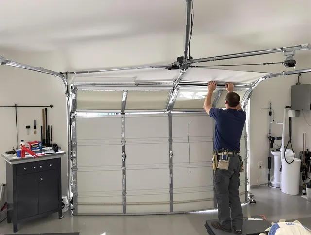 Bay Village Garage Door Repair specialist performing precise section replacement on Bay Village garage door