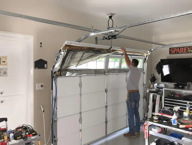 Garage door section replacement by Bay Village Garage Door Repair in Bay Village